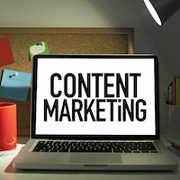 Content marketing concept with laptop in office interior
